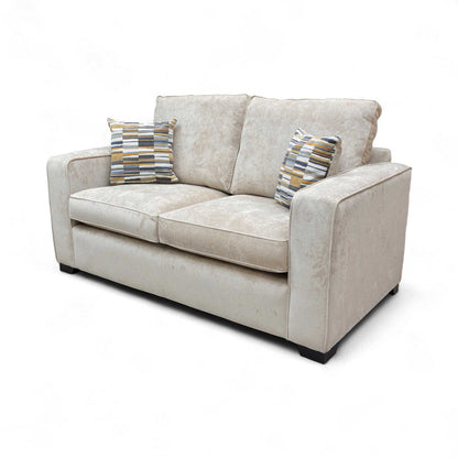 Detailed close-up of the Cream Fabric texture and the contrasting dark wood feet of the sofa.