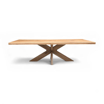 Full view of the spacious Terra 04 Desert Solid Oak Dining Table, highlighting the light wood oak top and wooden star base.