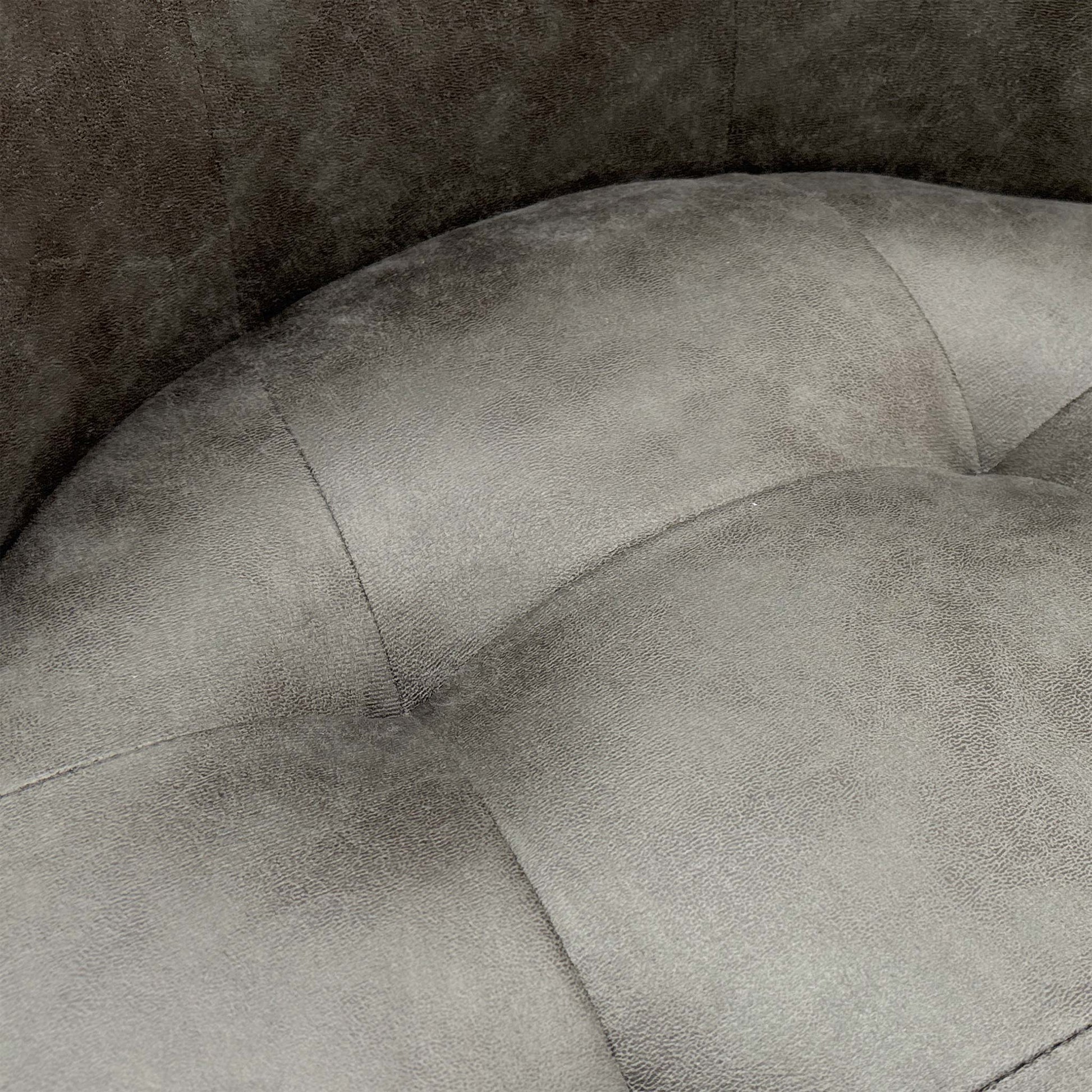 Close-up showing the suede fabric texture and the subtle back buttoning.