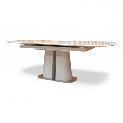The table shown extended to 220cm.