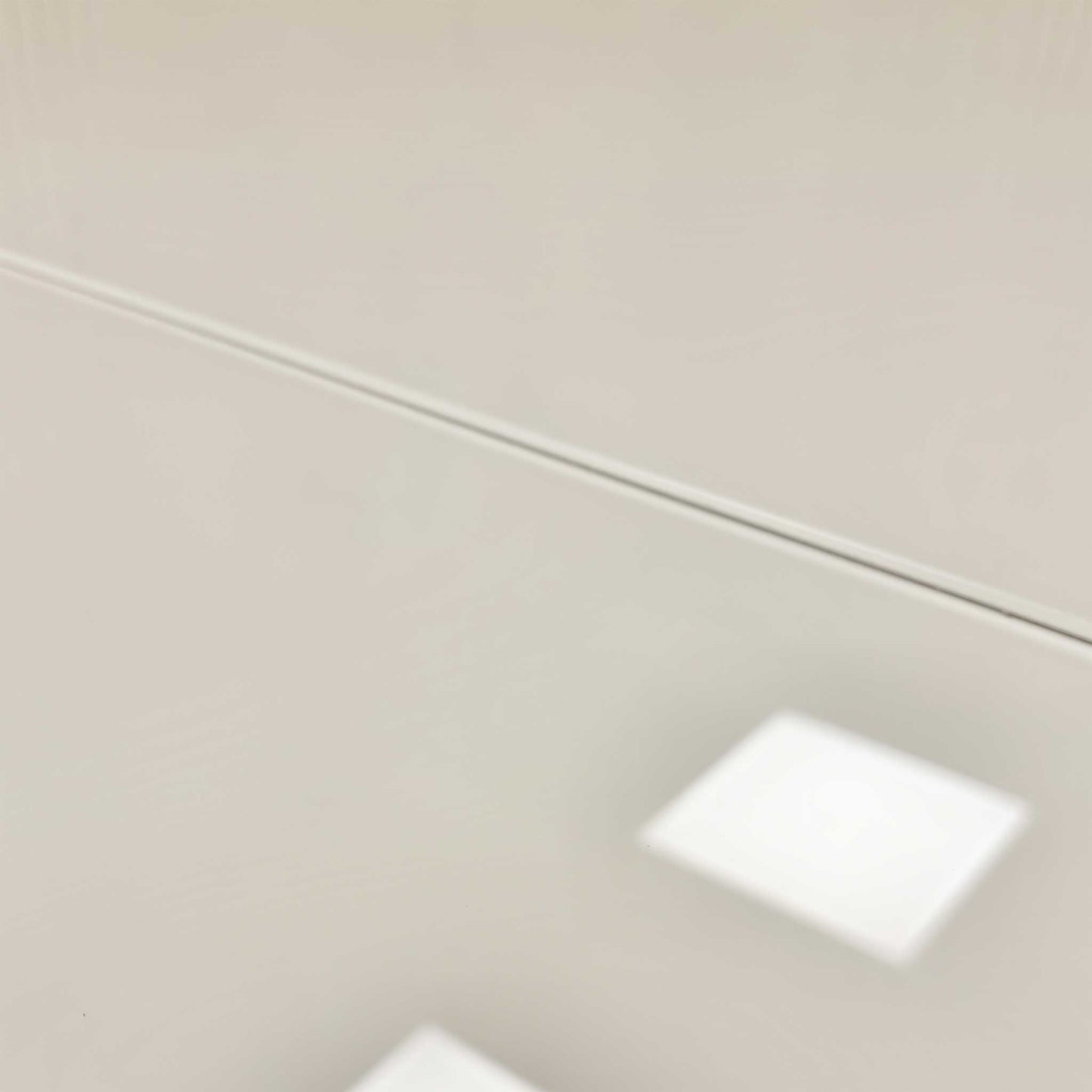 Close-up of the table's modern base structure.