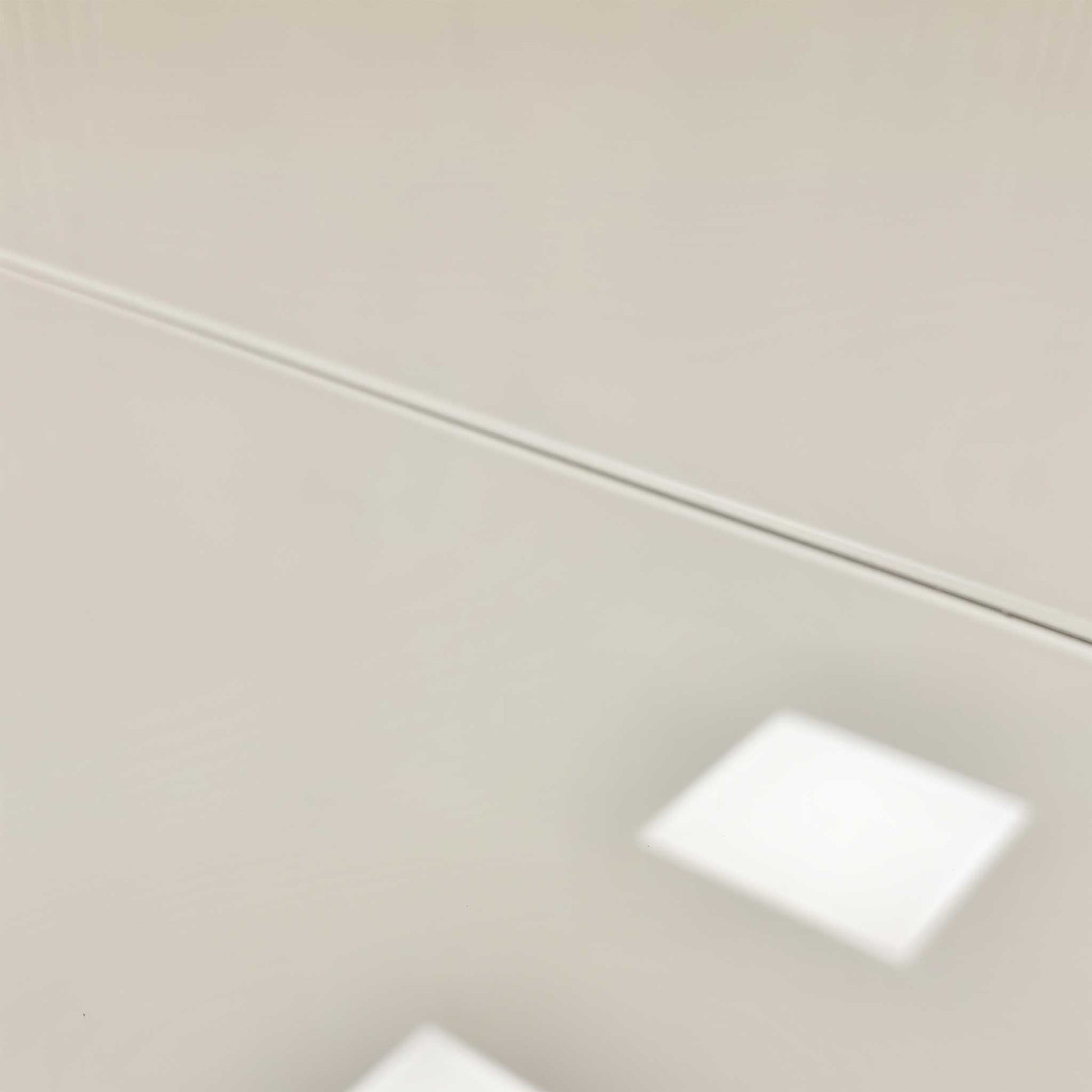 Close-up of the table's modern base structure.