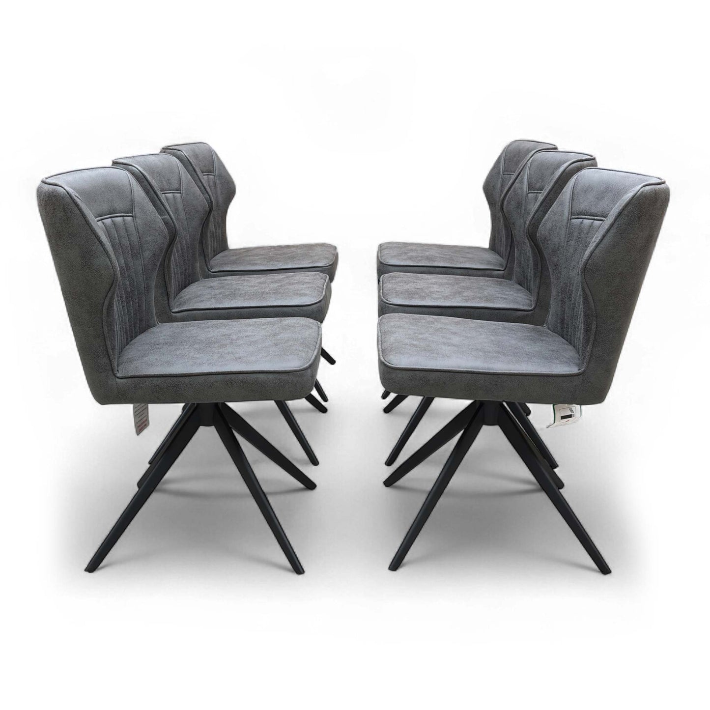 Full front view of the Aydin Swivel Dining Chair in Dark Grey Soft Faux Leather, showcasing its modern shape and on-trend stitching detail.