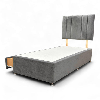 View of the bed showing one of the two drawers open.