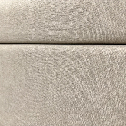 Close-up on the headboard and the upholstered fabric.