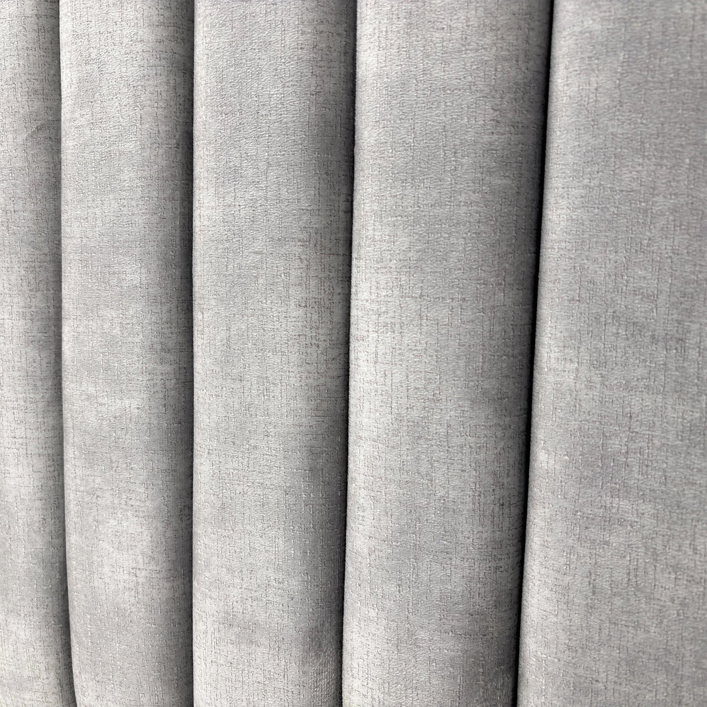 Close-up on the decorative Lace detailing and stitching pattern on the Dolphin Velvet headboard.