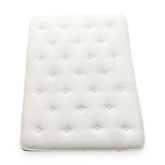 A full perspective view of the Sleep Story Pocket Luxury 1000 Super King mattress, featuring a white tufted top and a contrasting grey fabric border.