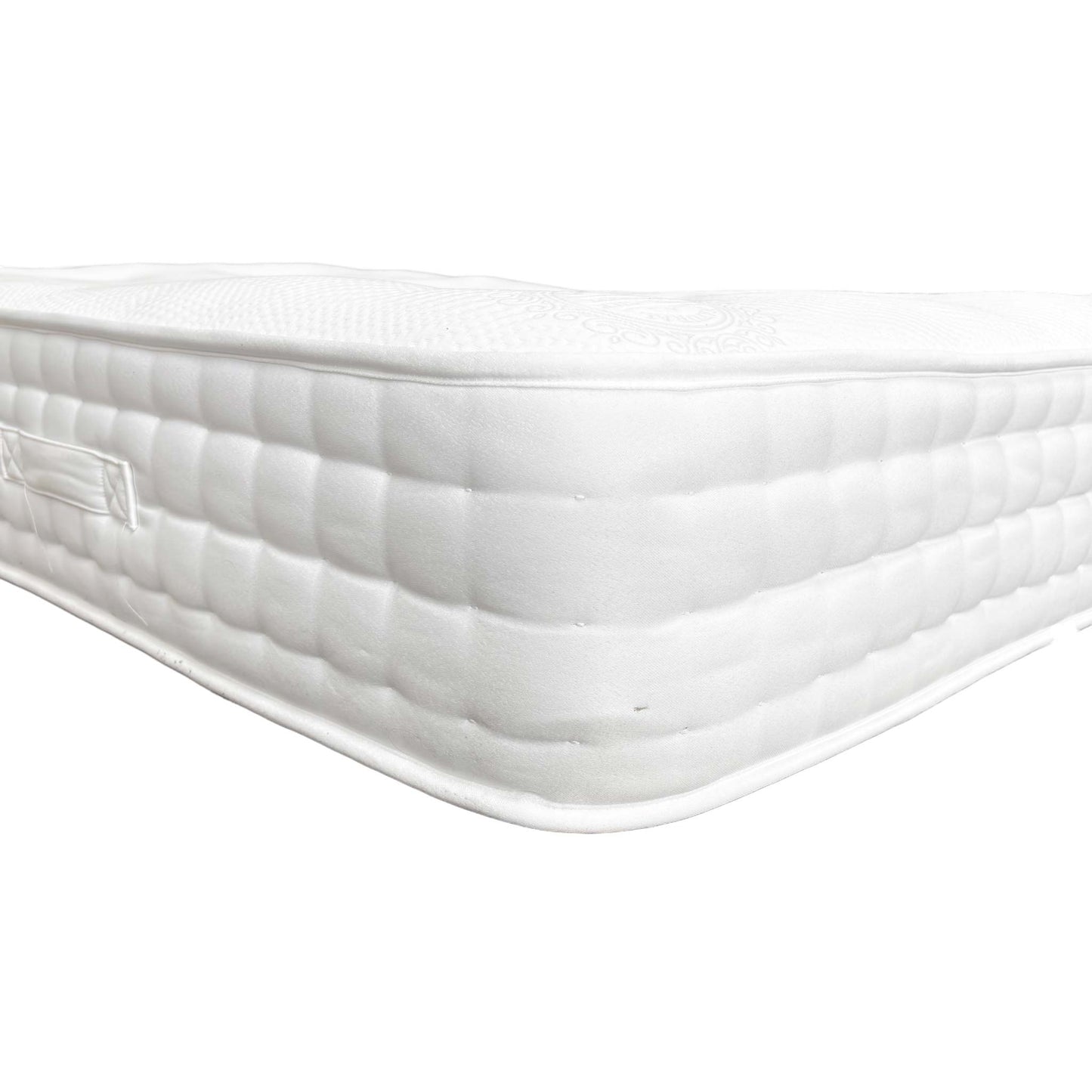 Close-up of the mattress's tufted surface, illustrating the quality and feel of the cover.