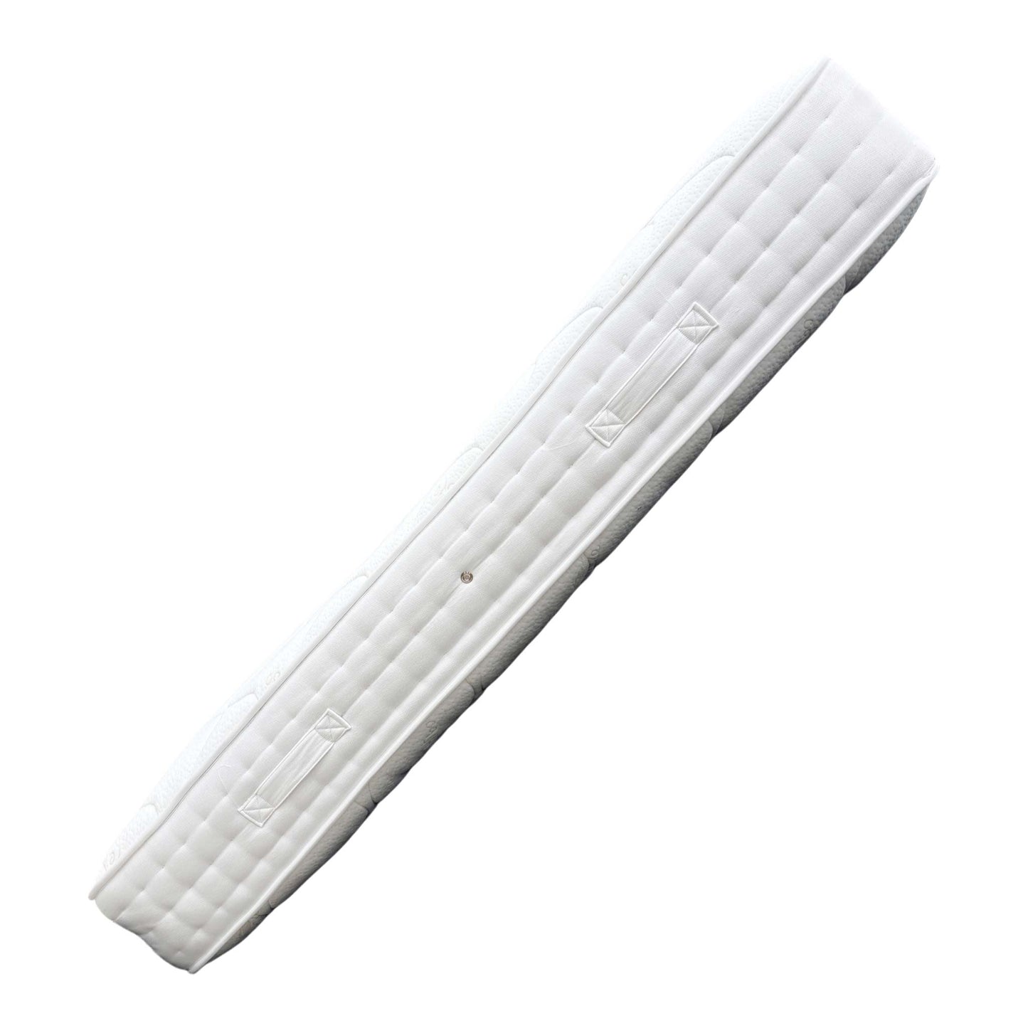 Detail shot of the mattress corner, showing the finish and border detail.