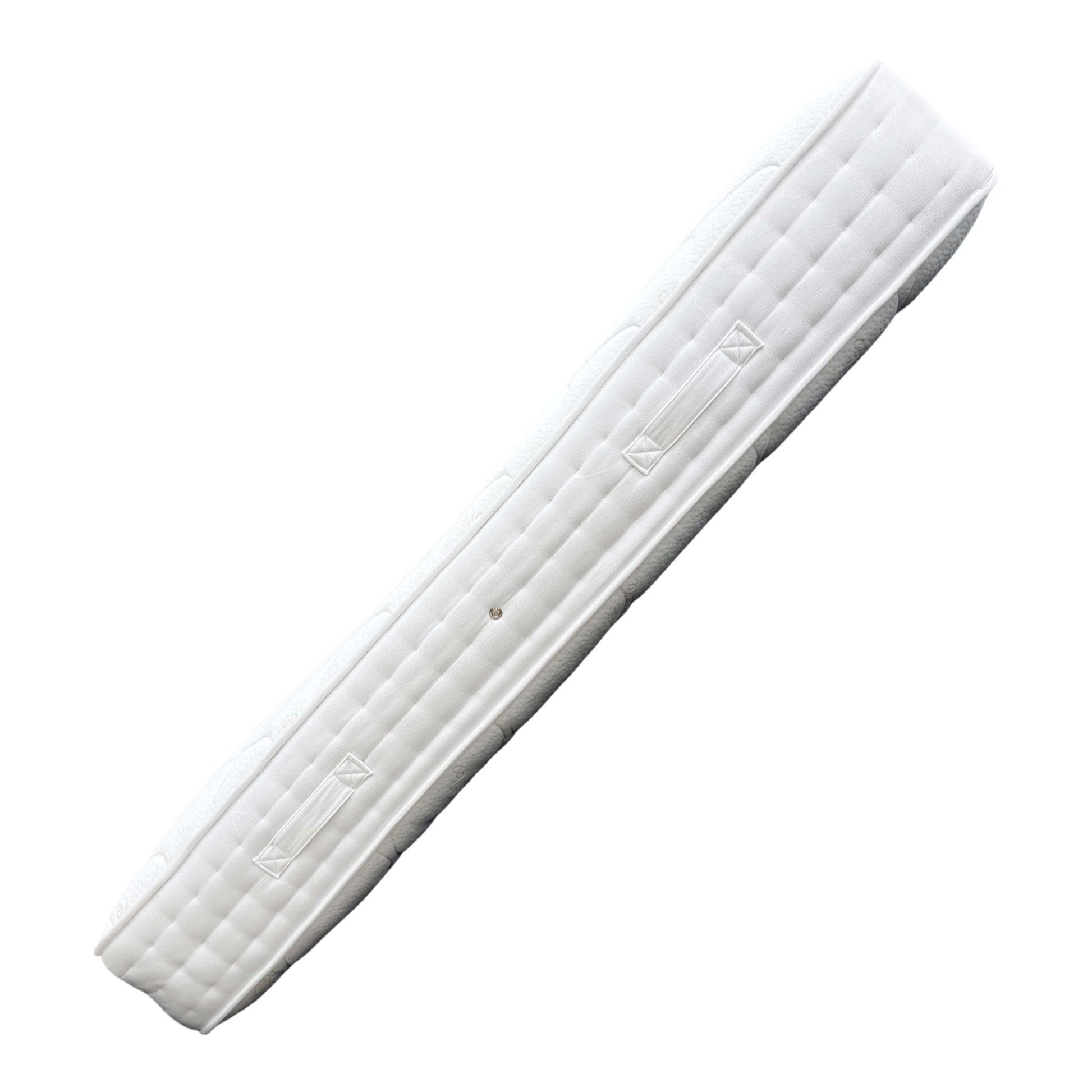 Detail shot of the mattress corner, showing the finish and border detail.