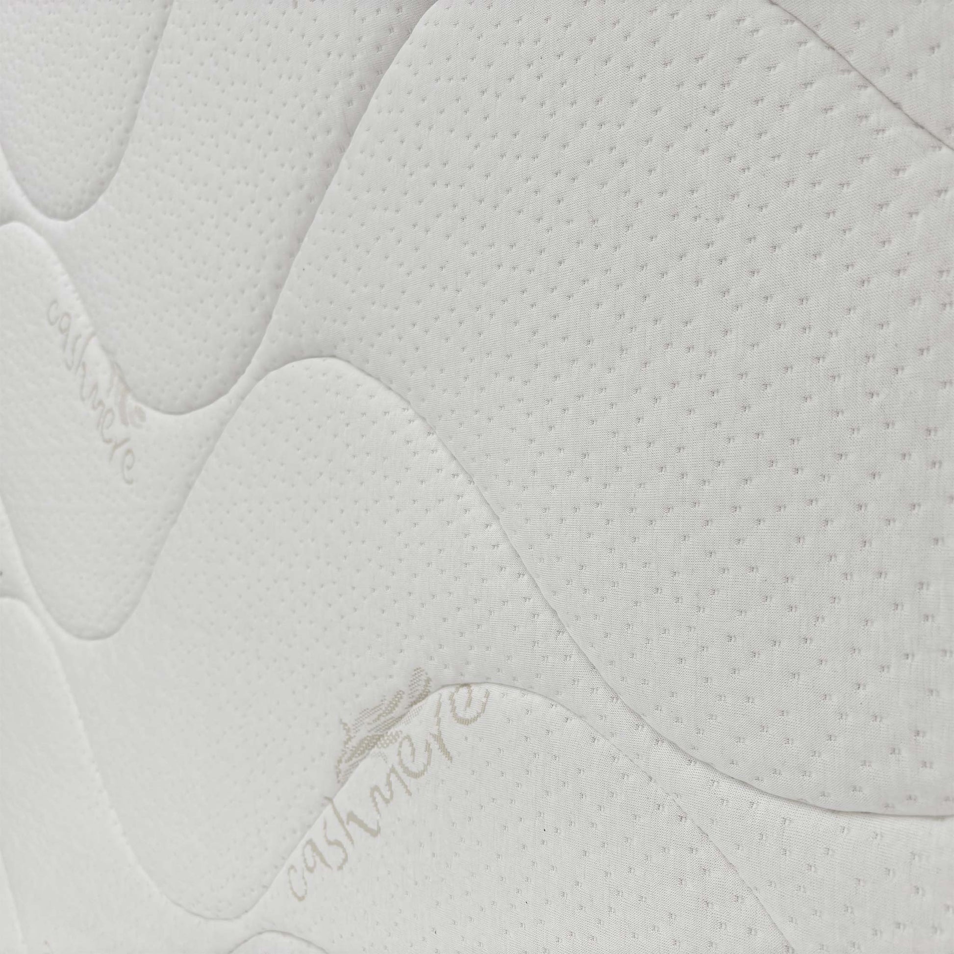 Close-up of the mattress side, emphasizing the quality stitching and construction of the extra firm support system.