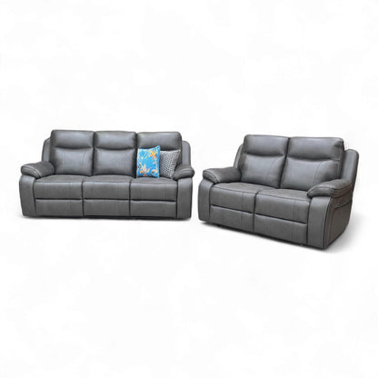 Angled view of the sofas in a room.