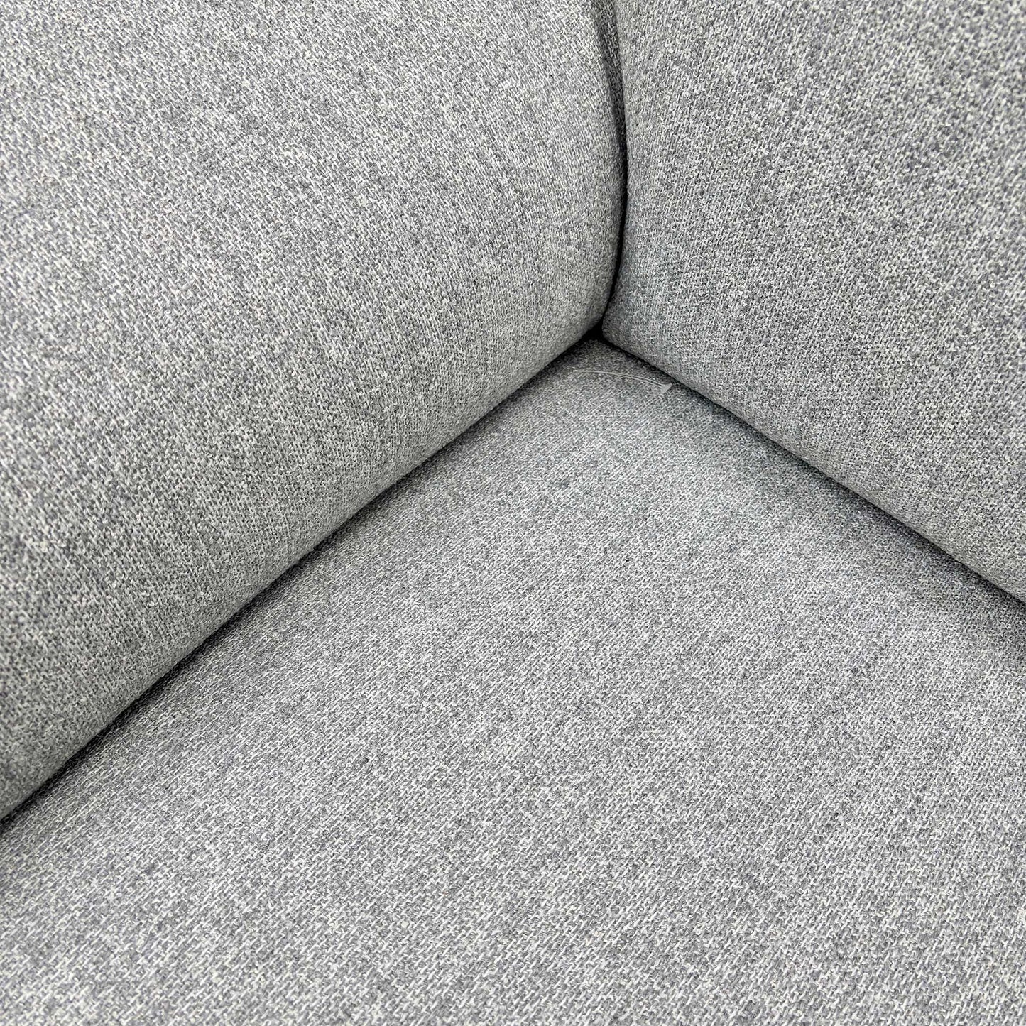 Detailed close-up showing the Stone Grey 40501 tight weave fabric and quality stitching on the sofa upholstery.
