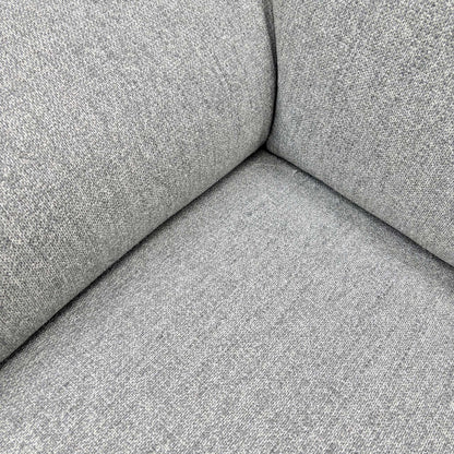 Detailed close-up showing the Stone Grey 40501 tight weave fabric and quality stitching on the sofa upholstery.