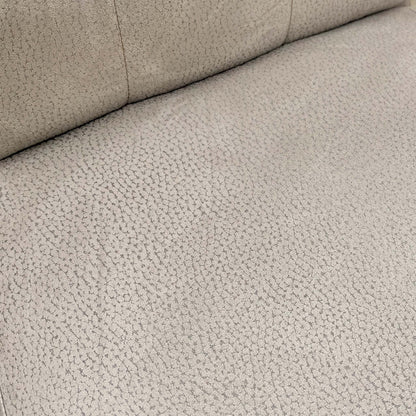 close-up of the button-back detail and texture of the silver suede upholstery on the Mia Dining Chair.
