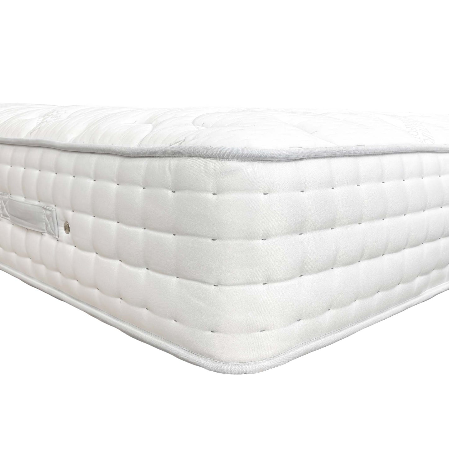 Detail shot of the breathable fabric cover and hypoallergenic properties of the Highgrove Raglan 3000 King Mattress.