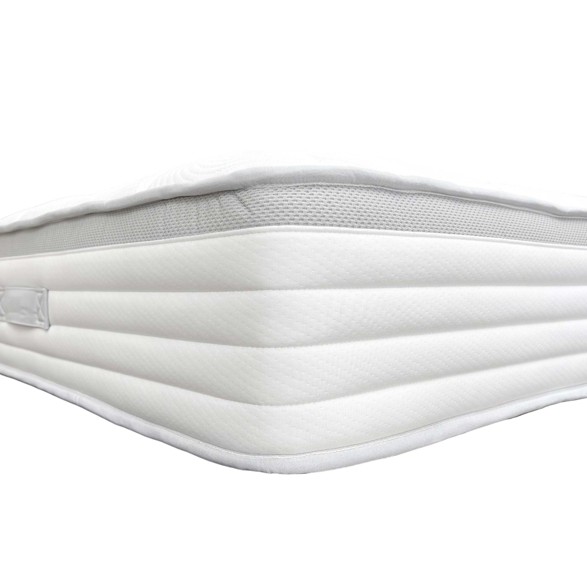 Detail shot of the breathable fabric cover and solid white color of the Medius 1500 Pocket Sprung King Mattress.