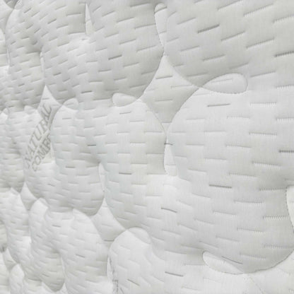 Close-up of the hand-tufted mattress surface and side border, showing the craftsmanship and thick, supportive edge.