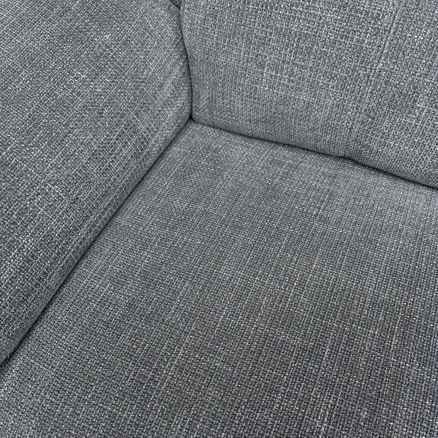 Detail shot of the Gunmetal Grey Woven Fabric and the comfortable fixed seat cushions with pocket coil spring suspension.