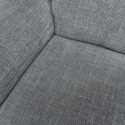 Detail shot of the Gunmetal Grey Woven Fabric and the comfortable fixed seat cushions with pocket coil spring suspension.