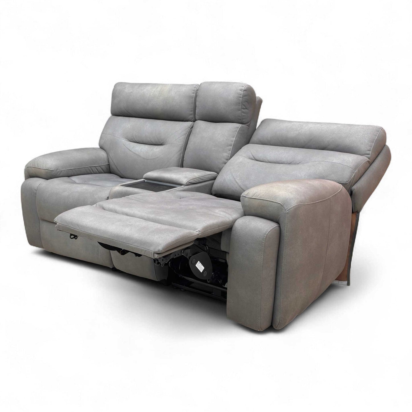 The Cinemax sofa in a partially reclined position, showing the generous body-hugging curves and medium comfort cushioning.