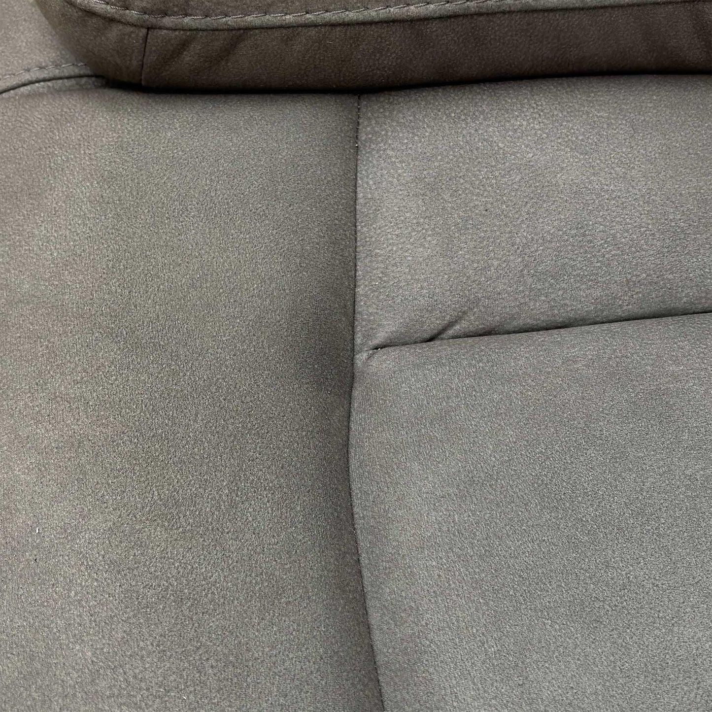 Close-up of the center media console of the Cinemax 2 Seater Power Recliner Sofa, featuring cupholders and storage in Nappa Grey fabric.