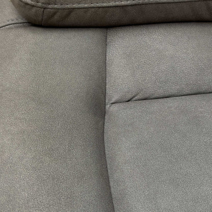 Close-up of the center media console of the Cinemax 2 Seater Power Recliner Sofa, featuring cupholders and storage in Nappa Grey fabric.