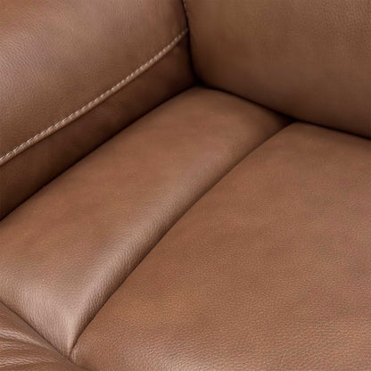 Detail shot of the Roast Brown leather texture on the armrest and side panel of the Cinemax Sofa.