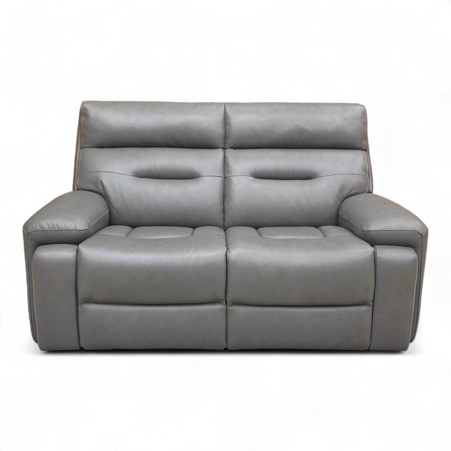 Frontal view of the Cinemax Grey Leather Sofa, highlighting its medium comfort level and fixed seat cushions.