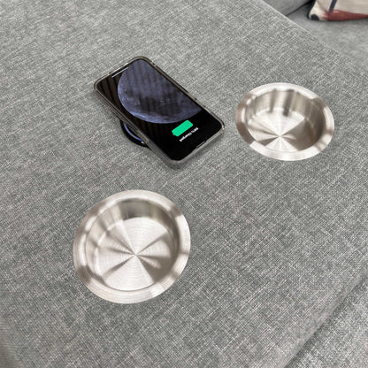 Close-up shot of the two circular cup holders within the dropped-down console of the middle seat.