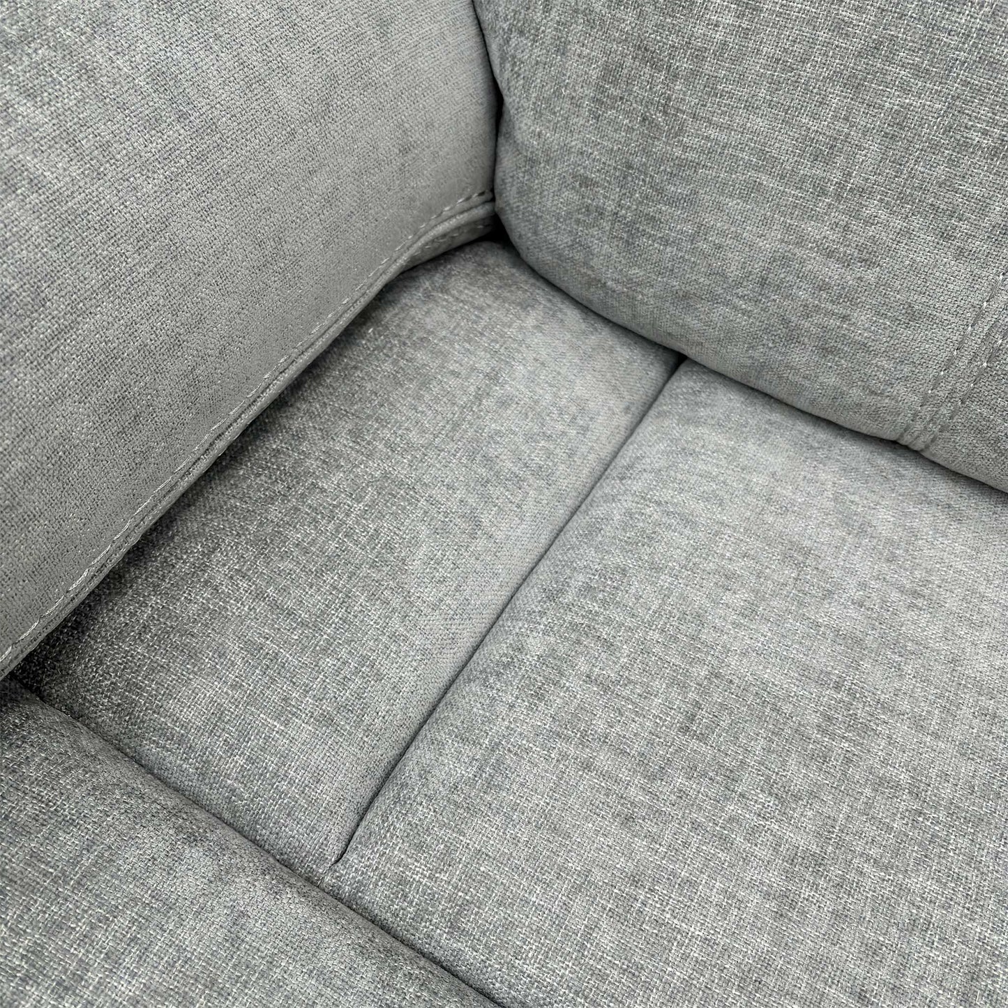 Detailed shot of the Light Grey Fabric upholstery and the plush, foam-filled seat cushion of the Weston sofa.