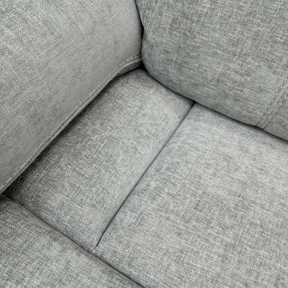 Detailed shot of the Light Grey Fabric upholstery and the plush, foam-filled seat cushion of the Weston sofa.