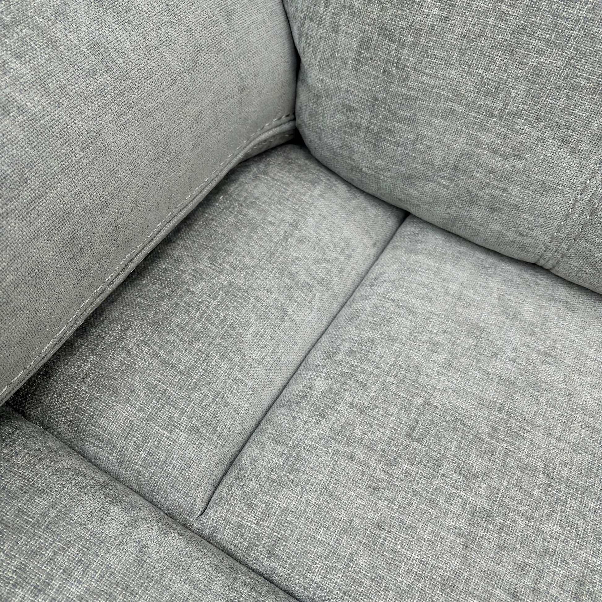 Detailed shot of the Light Grey Fabric upholstery and the plush, foam-filled seat cushion of the Weston chair.