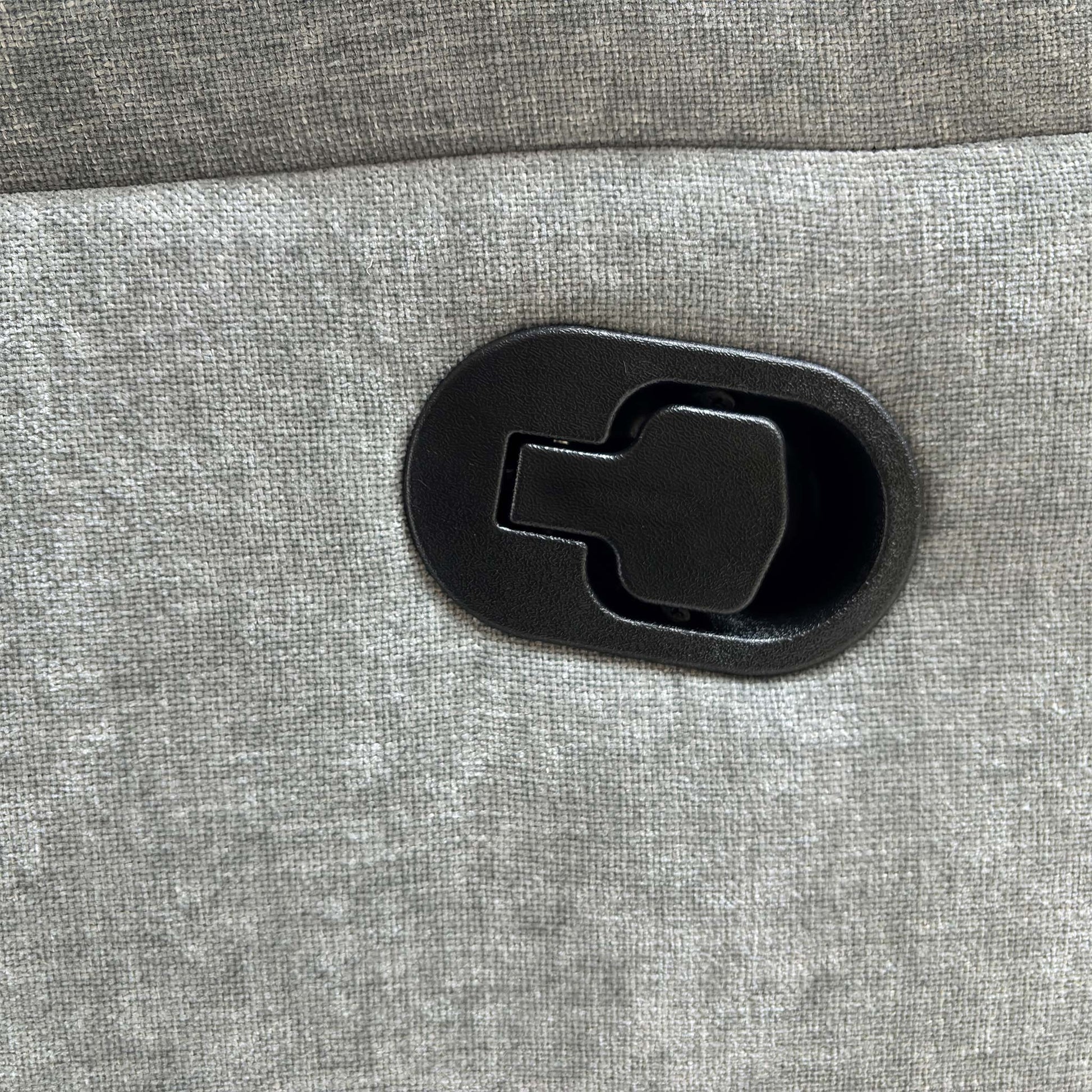 Detailed shot of the manual recliner release lever positioned on the side of the chair.