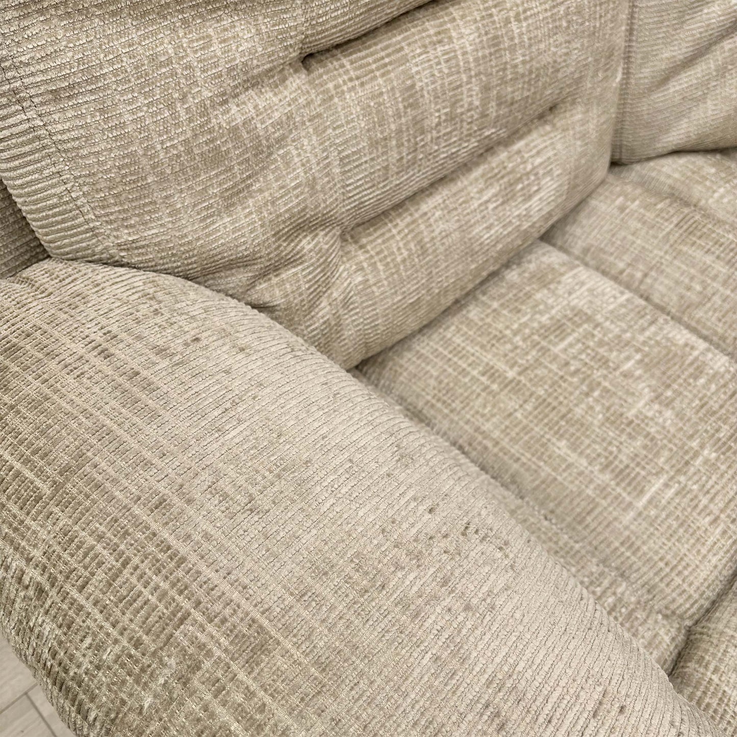 Close-up of the Latte fabric texture and stitching.