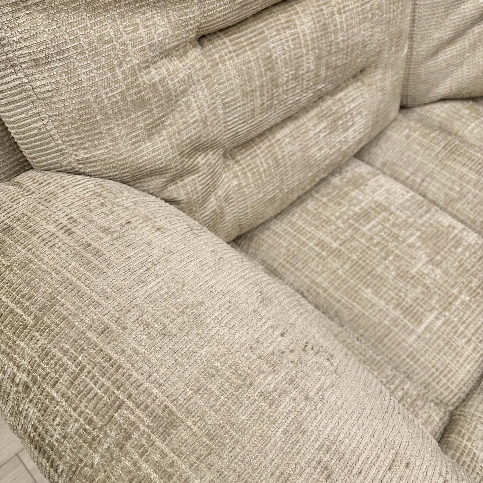 Close-up of the Latte fabric texture and stitching.