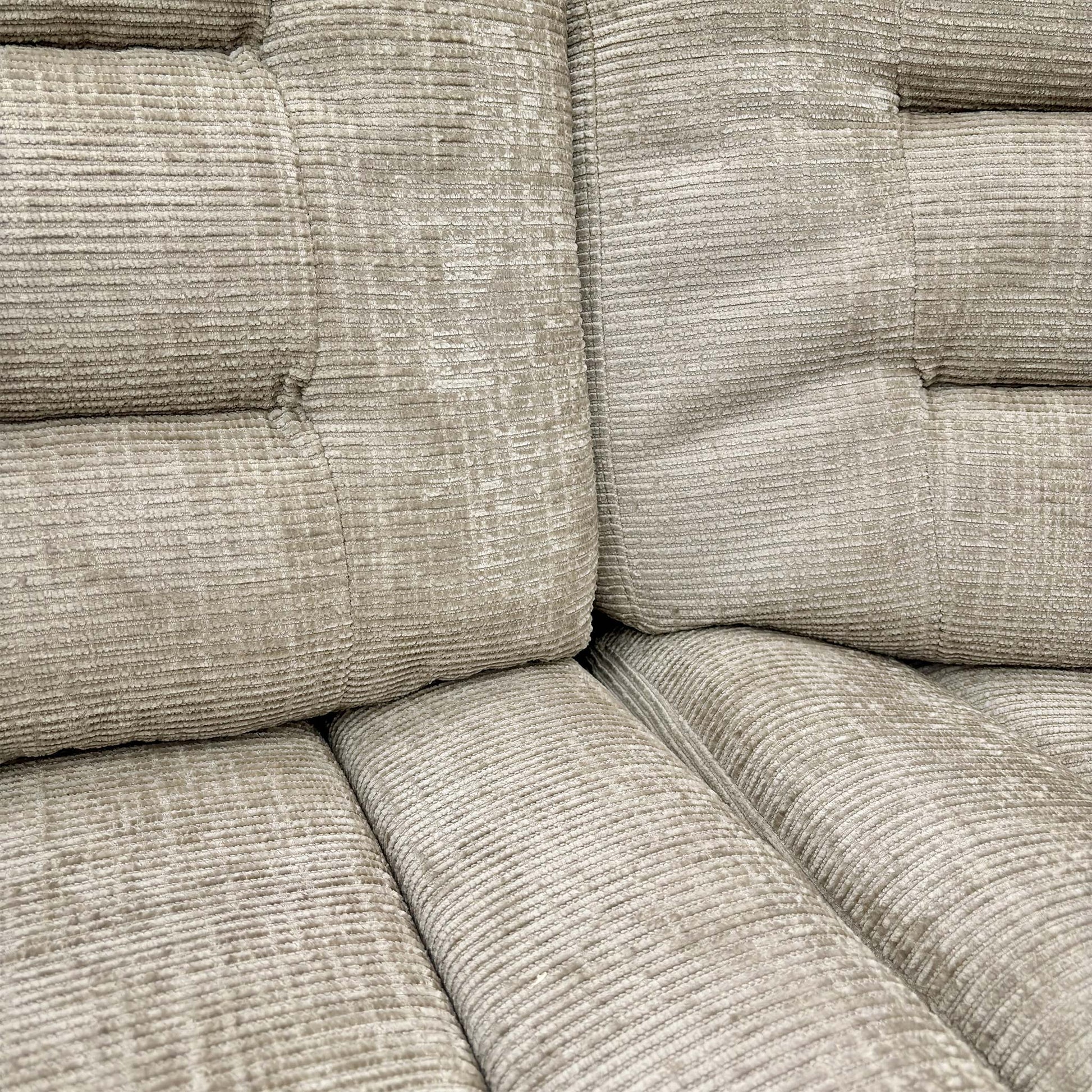 Close-up detail of the Latte colour upholstery fabric used on the Wilbur sofa, showing the soft texture.