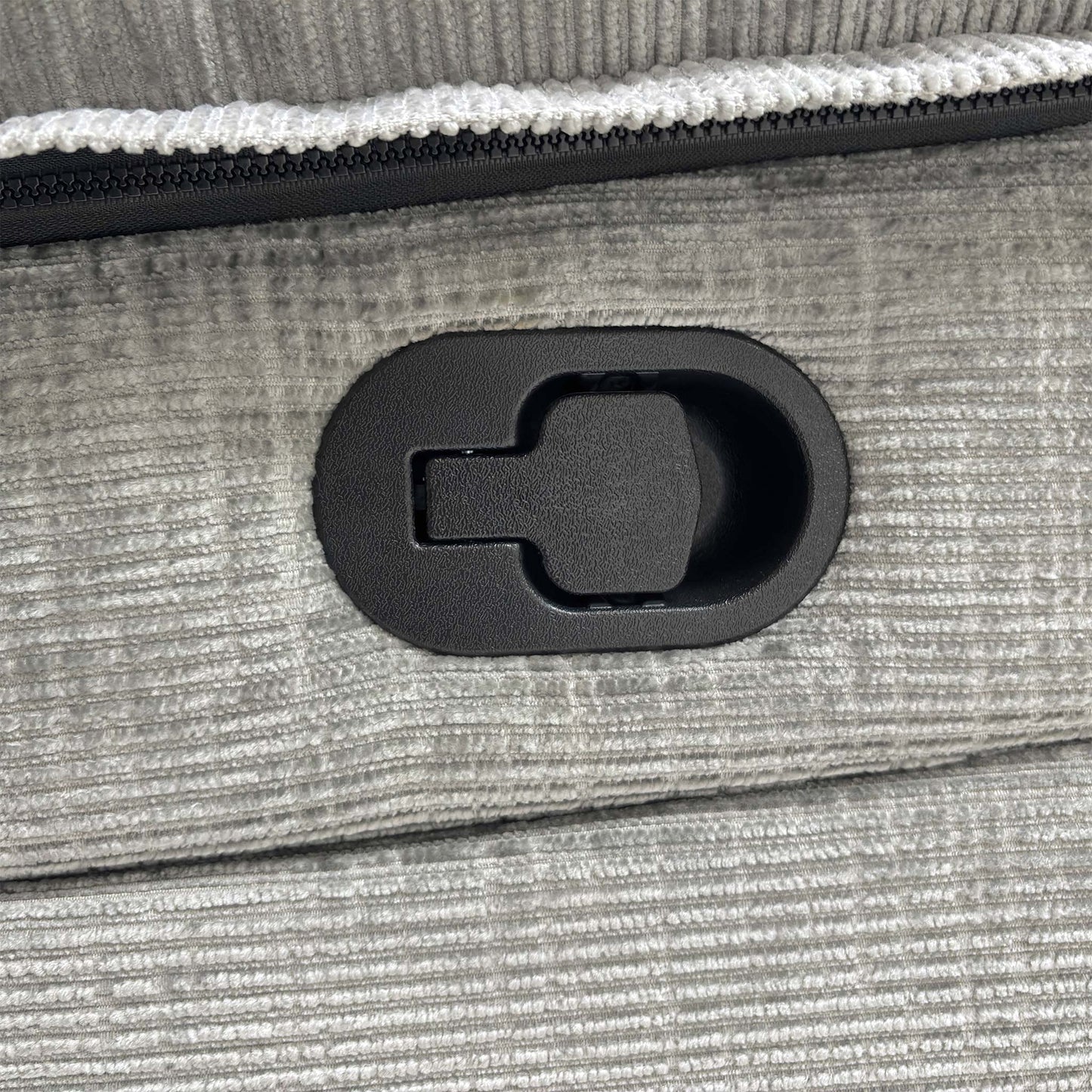 Detail shot of one of the manual recliner seats on the Wilbur sofa, extended for comfort.