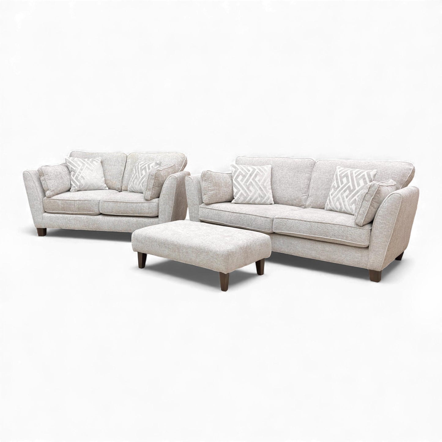 Angled view of the Tabitha 3 Seater Sofa and matching Bench Stool, emphasizing the super-soft chenille upholstery.
