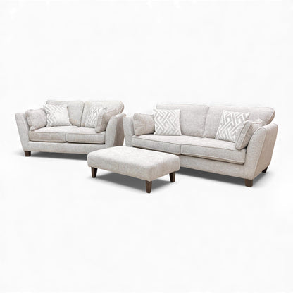 Angled view of the Tabitha 3 Seater Sofa and matching Bench Stool, emphasizing the super-soft chenille upholstery.