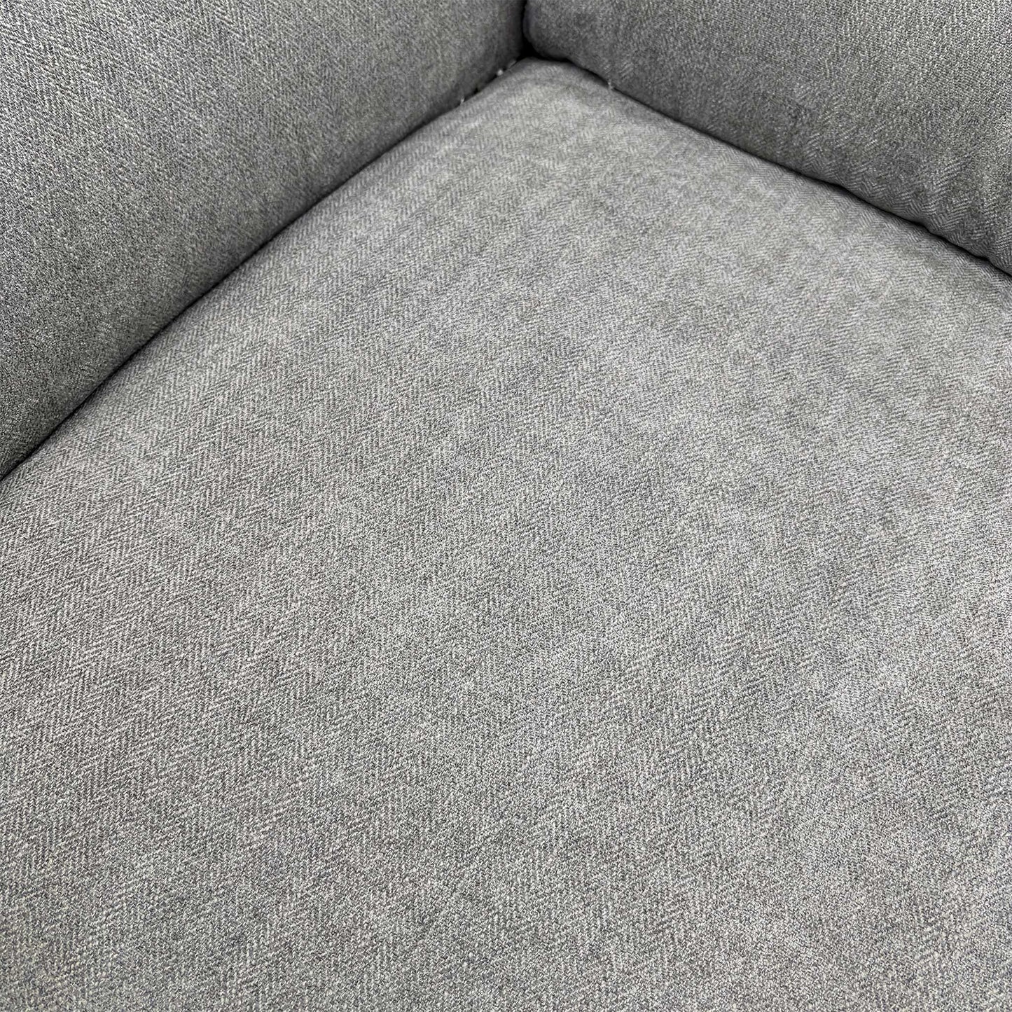 Close-up of the seat cushions and arm.