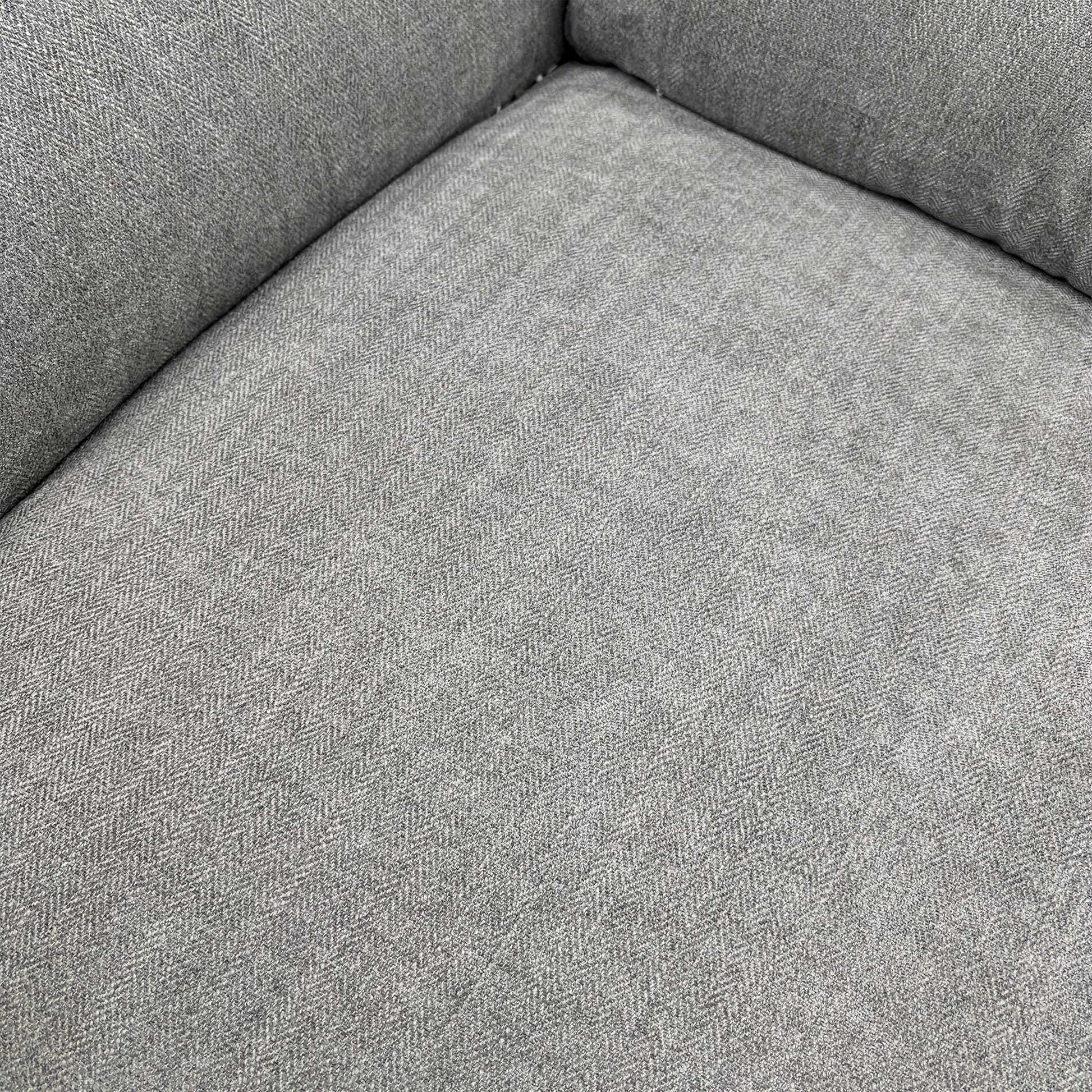 Close-up of the seat cushions and arm.