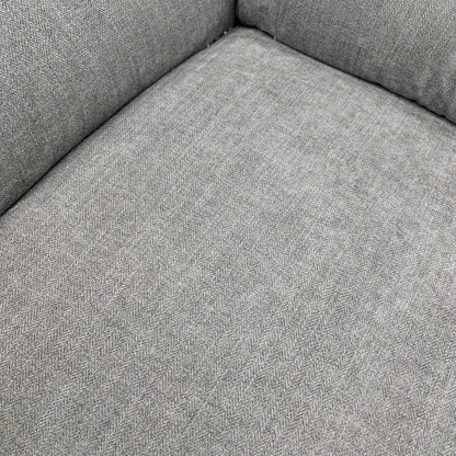 Close-up of the seat cushions and arm.