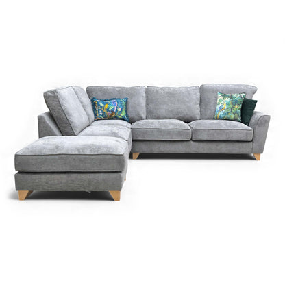 Angled front view of the Legend Kingston Corner Sofa in Grey Fabric, set up with the footstool to create a large chaise end.