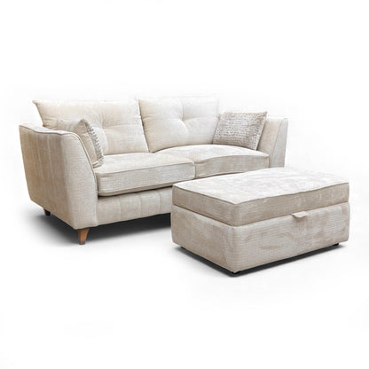 Full angled view of the 3-seater sofa and the footstool in a room setting.