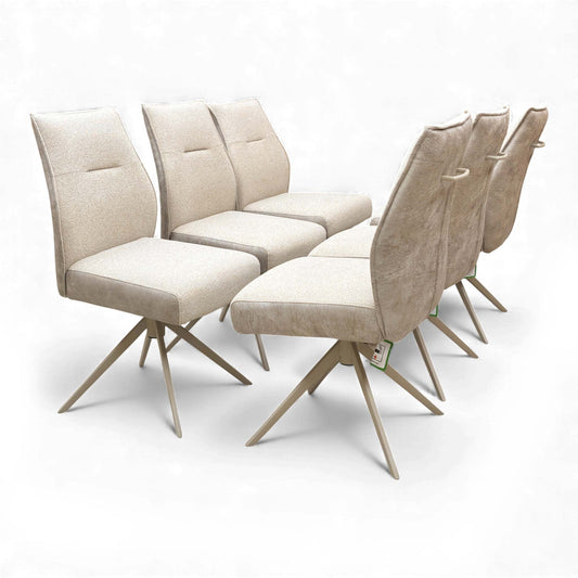 Angled view of a single swivel chair with neutral fabric upholstery.