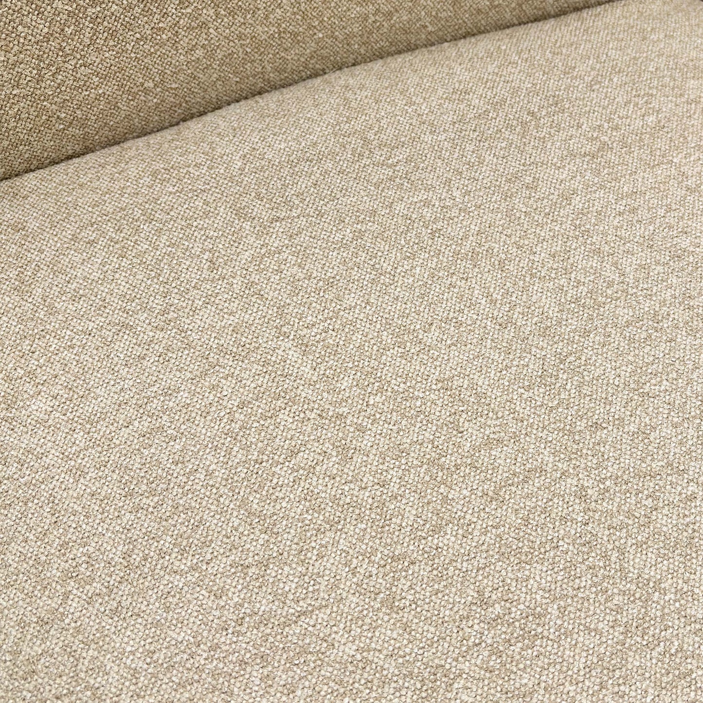 Close-up of the neutral fabric upholstery and cushioned seat.