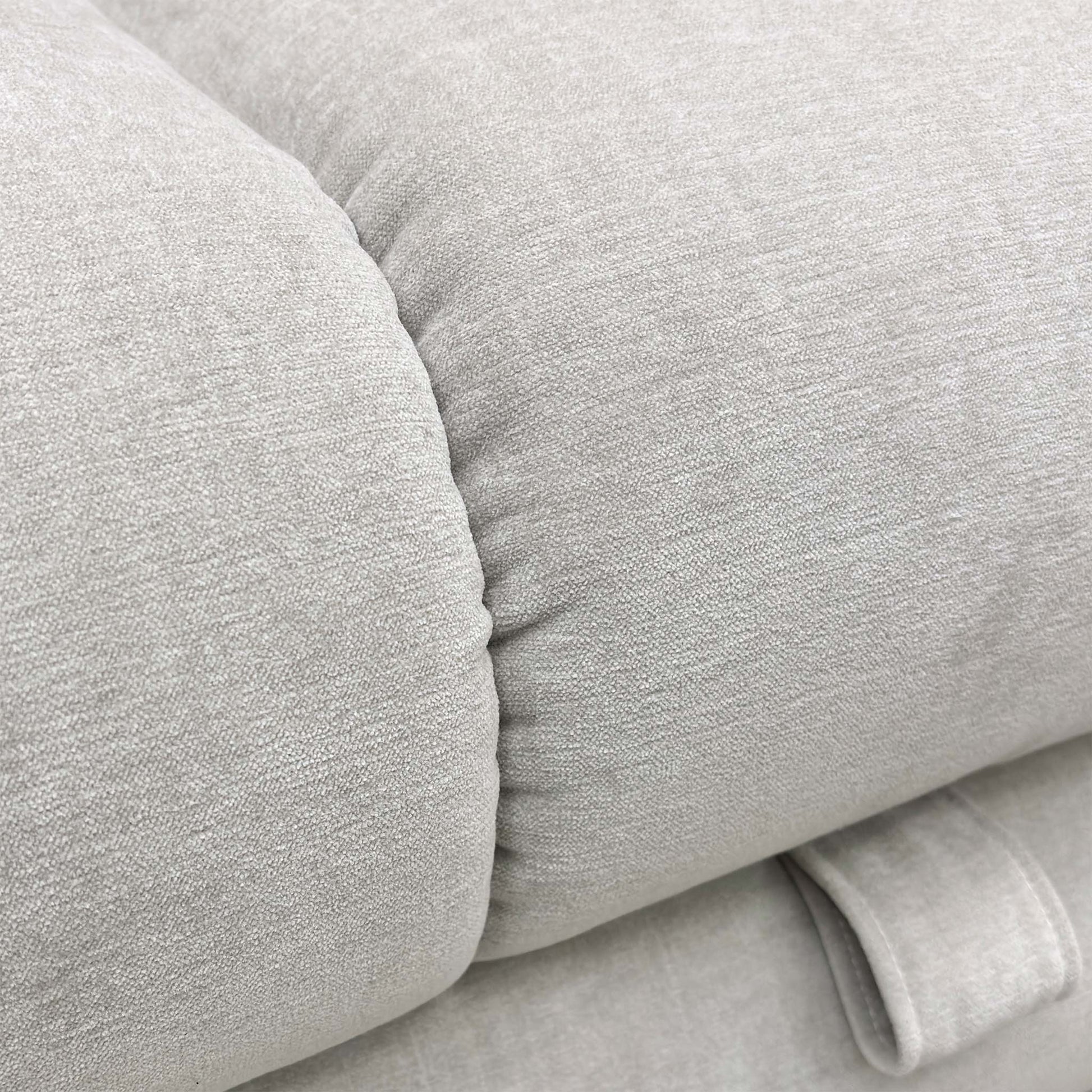 Close-up of the footstool's surface, showing the chenille texture.