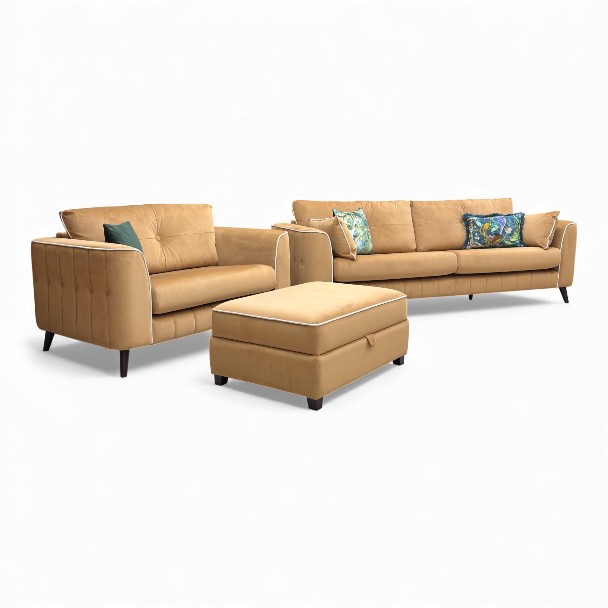 Angled view of the entire set: Grande Sofa, Loveseat, and Storage Footstool.
