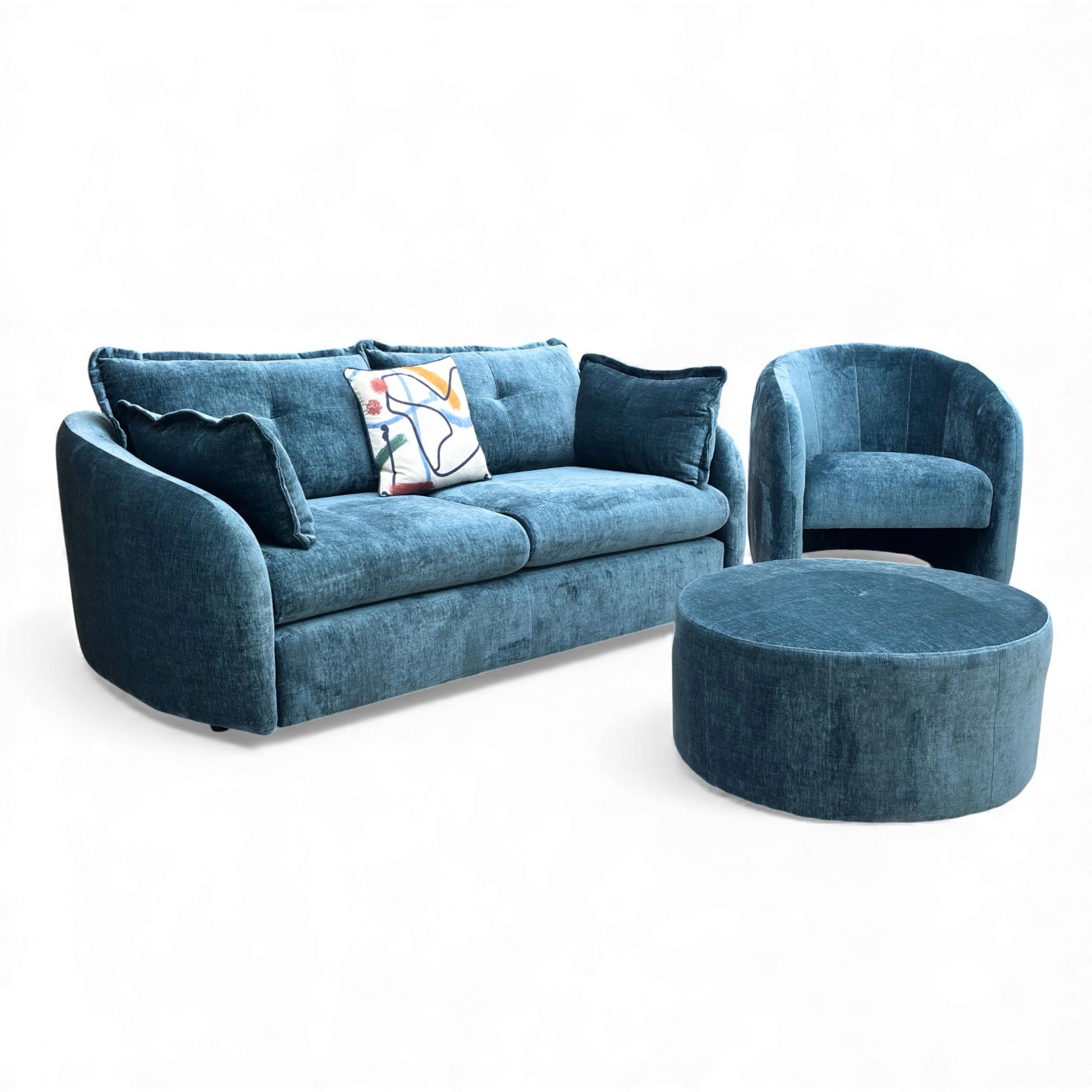 Angled view of the Portobello 3 Seater Sofa, Accent Chair, and Round Footstool in Navy Blue Luxury Chenille.